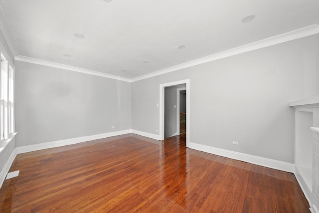 8045 S Escanaba Ave, Chicago, IL 60617 - unfurnished room with baseboards, ornamental molding, wood finished floors, and a fireplace