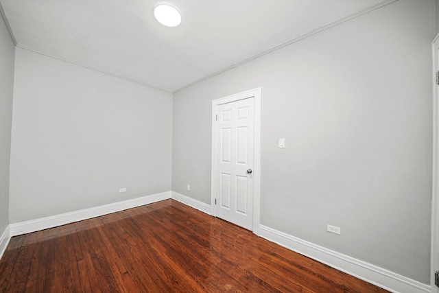 8045 S Escanaba Ave, Chicago, IL 60617 - empty room featuring crown molding, baseboards, and dark wood-style floors