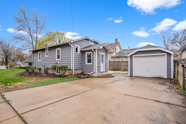 view of front of home featuring fence, a garage, cooling unit, and concrete driveway