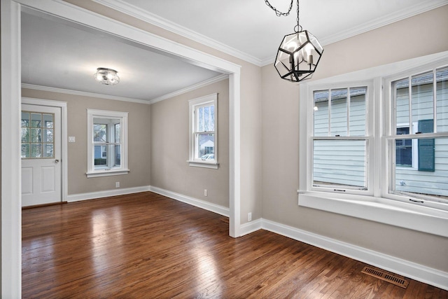 unfurnished dining area with a healthy amount of sunlight, wood finished floors, and visible vents
