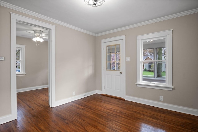 foyer entrance featuring ceiling fan, baseboards, crown molding, and dark wood-type flooring