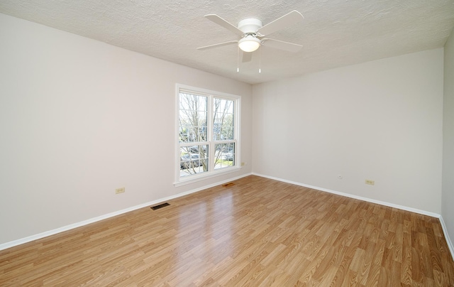 4150 Brentwood Ln, Waukegan, IL 60087 - empty room featuring light wood-type flooring, baseboards, ceiling fan, and a textured ceiling