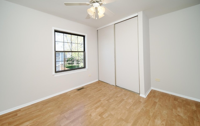 4150 Brentwood Ln, Waukegan, IL 60087 - unfurnished bedroom with light wood-style floors, a closet, baseboards, and ceiling fan