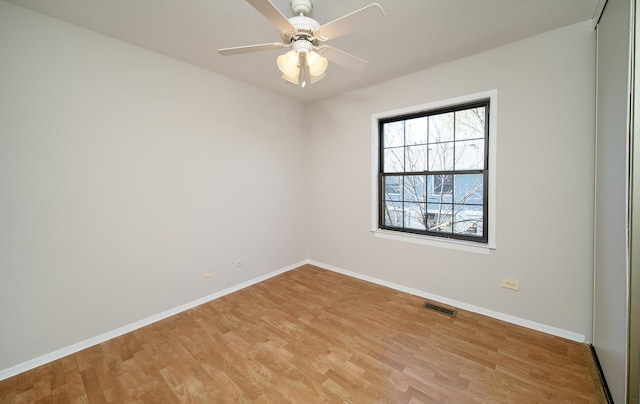 4150 Brentwood Ln, Waukegan, IL 60087 - spare room featuring light wood-style flooring, baseboards, and a ceiling fan
