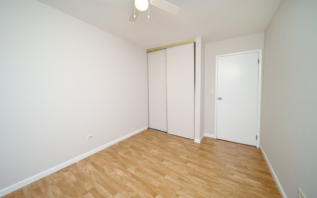 4150 Brentwood Ln, Waukegan, IL 60087 - unfurnished bedroom featuring light wood-style floors, a closet, baseboards, and ceiling fan
