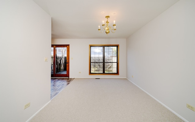 4150 Brentwood Ln, Waukegan, IL 60087 - empty room with a chandelier, baseboards, and carpet floors