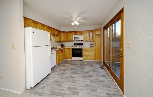 4150 Brentwood Ln, Waukegan, IL 60087 - kitchen featuring white appliances, a ceiling fan, light countertops, a sink, and light wood-type flooring