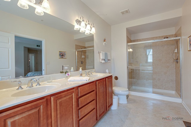 ensuite bathroom featuring visible vents, a sink, tile patterned floors, and a shower stall