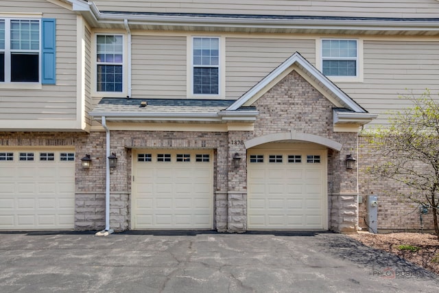 garage featuring driveway