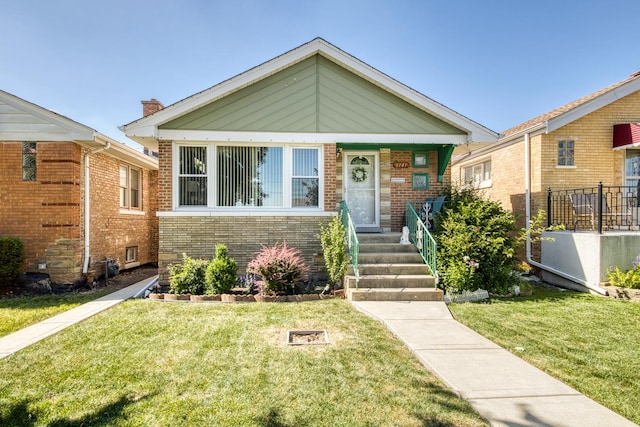 6141 W 35th St, Cicero, IL 60804 - bungalow with brick siding and a front yard