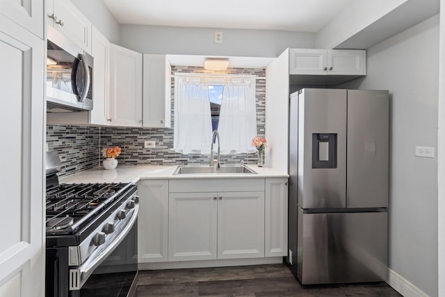 6141 W 35th St, Cicero, IL 60804 - kitchen featuring appliances with stainless steel finishes, decorative backsplash, white cabinetry, and light countertops