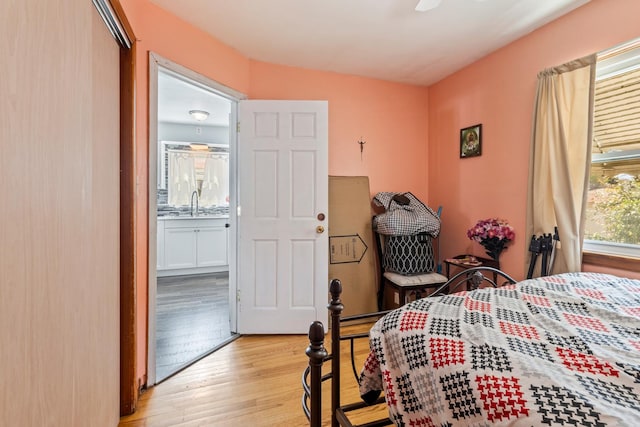 6141 W 35th St, Cicero, IL 60804 - bedroom with light wood-style flooring and a sink