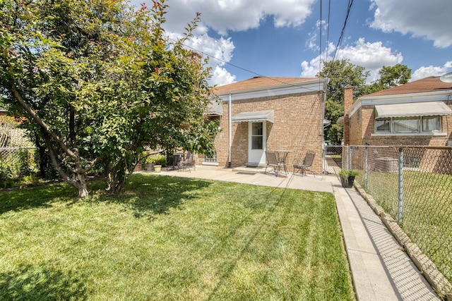 6141 W 35th St, Cicero, IL 60804 - back of house featuring brick siding and a patio