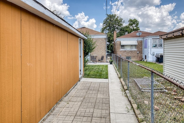 6141 W 35th St, Cicero, IL 60804 - view of side of home with a patio area and brick siding