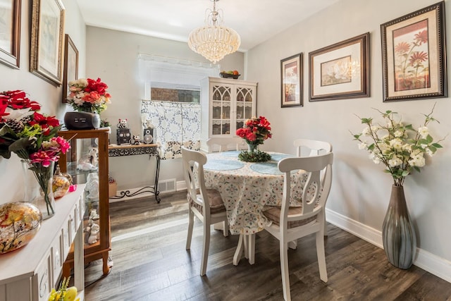 6141 W 35th St, Cicero, IL 60804 - dining space featuring a chandelier and dark wood-style floors