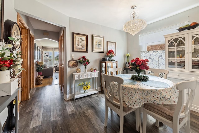 6141 W 35th St, Cicero, IL 60804 - dining area featuring dark wood finished floors and a chandelier