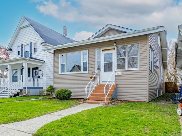 292 W 15th Pl, Chicago Heights, IL 60411 - bungalow with entry steps, a chimney, and a front yard