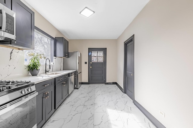 292 W 15th Pl, Chicago Heights, IL 60411 - kitchen with a sink, marble finish floor, stainless steel appliances, baseboards, and tasteful backsplash