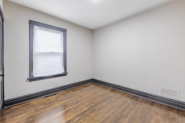292 W 15th Pl, Chicago Heights, IL 60411 - empty room featuring crown molding, baseboards, visible vents, and wood finished floors