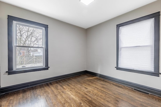 292 W 15th Pl, Chicago Heights, IL 60411 - empty room with baseboards, dark wood-style floors, and visible vents