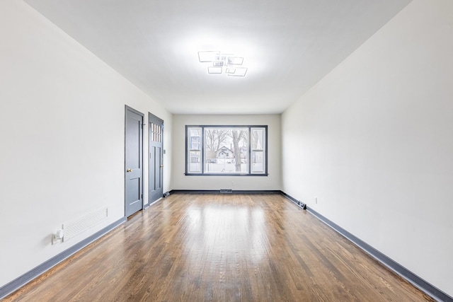 292 W 15th Pl, Chicago Heights, IL 60411 - unfurnished room featuring visible vents, baseboards, and wood finished floors