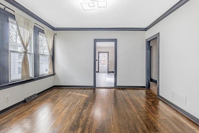 292 W 15th Pl, Chicago Heights, IL 60411 - unfurnished room featuring baseboards, visible vents, ornamental molding, and wood finished floors
