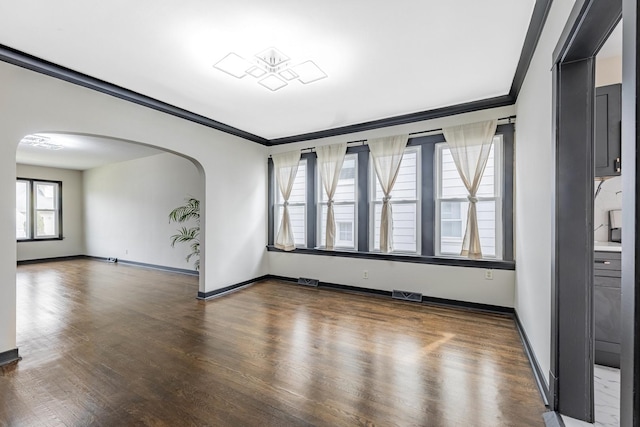 292 W 15th Pl, Chicago Heights, IL 60411 - unfurnished room with arched walkways, ornamental molding, wood finished floors, and visible vents