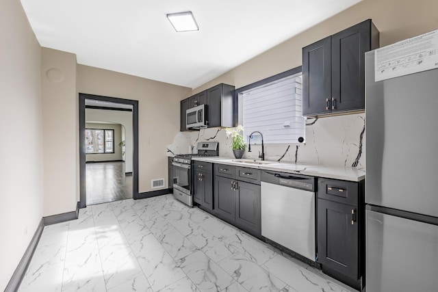 292 W 15th Pl, Chicago Heights, IL 60411 - kitchen with a sink, light countertops, marble finish floor, stainless steel appliances, and visible vents