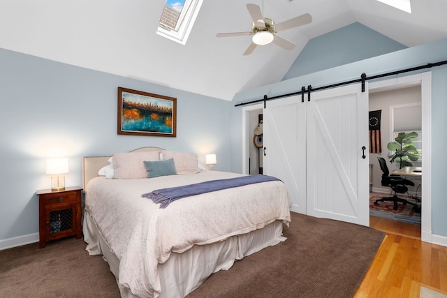 3727 N Paulina St, Chicago, IL 60613 - bedroom featuring a barn door, wood finished floors, a skylight, and ceiling fan