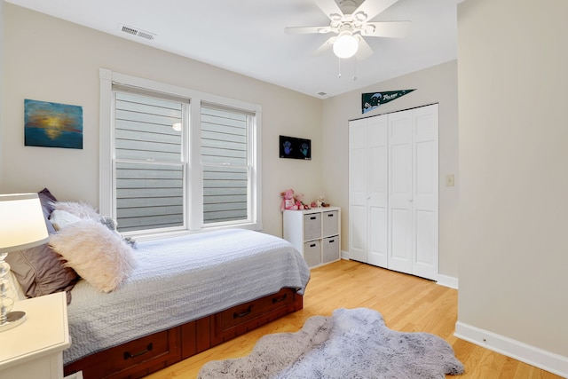3727 N Paulina St, Chicago, IL 60613 - bedroom with a ceiling fan, a closet, light wood-type flooring, baseboards, and visible vents