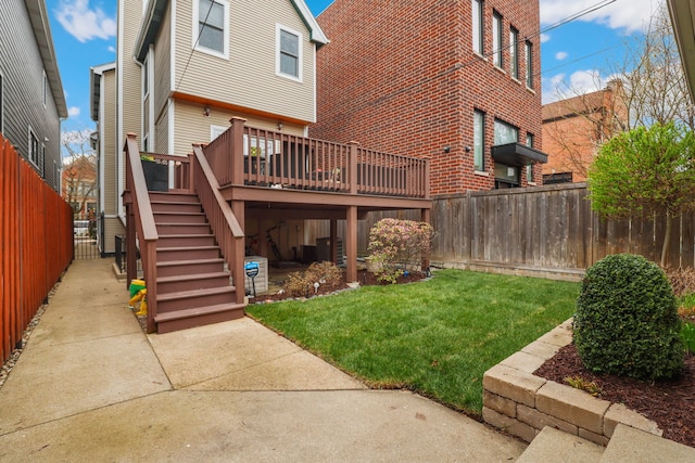 3727 N Paulina St, Chicago, IL 60613 - rear view of house featuring stairs, a yard, a wooden deck, and a fenced backyard