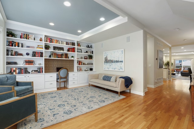 3727 N Paulina St, Chicago, IL 60613 - sitting room featuring built in desk, visible vents, ornamental molding, baseboards, and light wood-style flooring