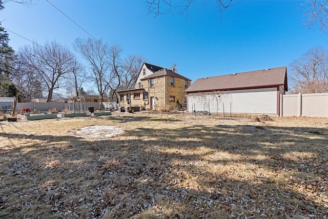 rear view of house with an outdoor hangout area and a fenced backyard