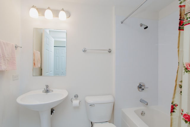 full bathroom featuring shower / tub combo and toilet