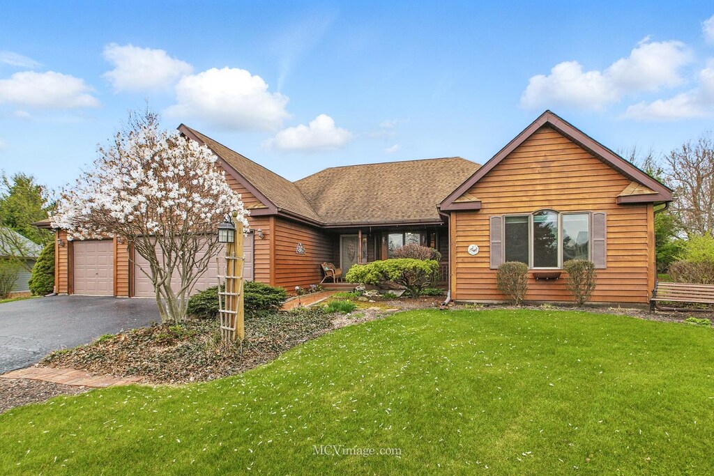 25038 S Timber Ct, Elwood, IL 60421 - view of front of property with a garage, a front lawn, and aphalt driveway