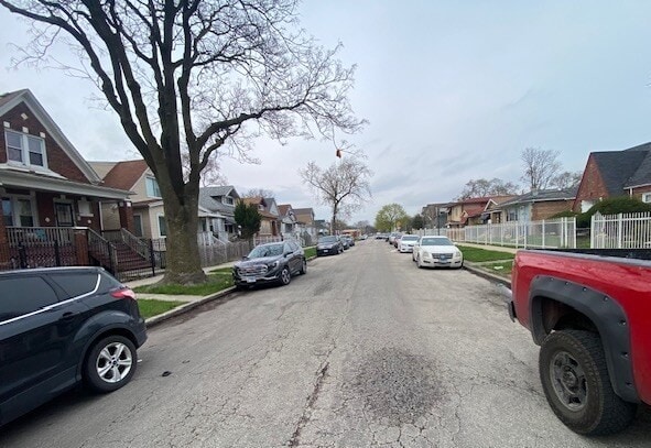 6954 S Honore St, Chicago, IL 60636 - view of road with curbs, sidewalks, and a residential view