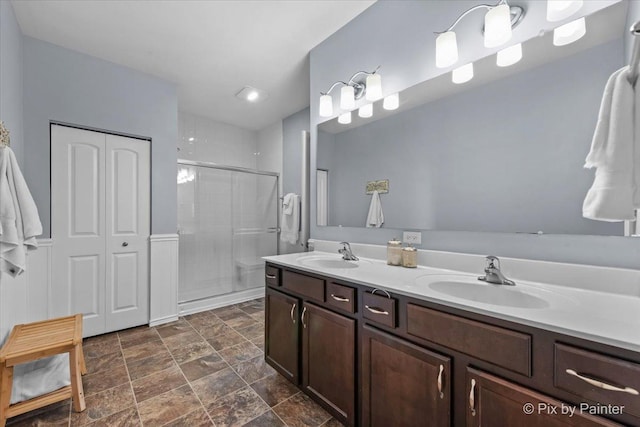 1348 Ritter St, North Aurora, IL 60542 - bathroom with double vanity, stone finish floor, a stall shower, and a sink