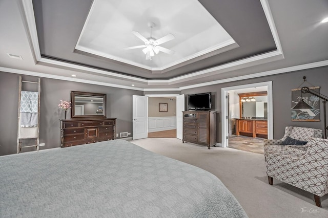 325 Bonnie Brae Ave, Itasca, IL 60143 - bedroom featuring a raised ceiling, crown molding, carpet flooring, connected bathroom, and a wainscoted wall