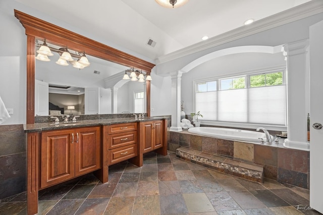325 Bonnie Brae Ave, Itasca, IL 60143 - bathroom with decorative columns, stone tile floors, a garden tub, double vanity, and crown molding