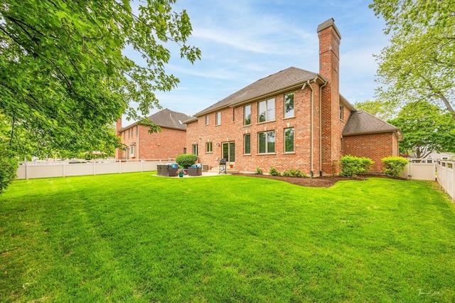 325 Bonnie Brae Ave, Itasca, IL 60143 - rear view of property featuring an outdoor living space, a chimney, brick siding, a fenced backyard, and a patio