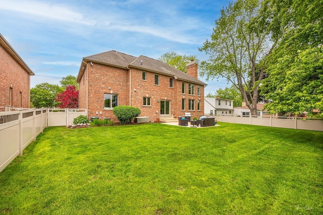 325 Bonnie Brae Ave, Itasca, IL 60143 - rear view of house with a chimney, entry steps, a fenced backyard, a patio, and an outdoor hangout area