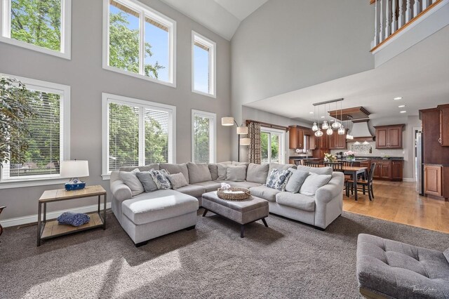 325 Bonnie Brae Ave, Itasca, IL 60143 - living area featuring a towering ceiling, light wood finished floors, recessed lighting, and a chandelier