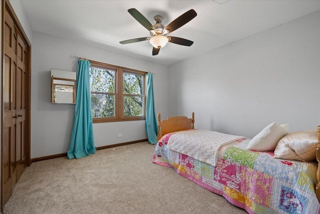 931 Sanctuary Ln, Naperville, IL 60540 - carpeted bedroom with visible vents, a closet, a ceiling fan, and baseboards