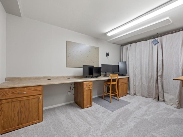 931 Sanctuary Ln, Naperville, IL 60540 - office area featuring baseboards, built in desk, and light carpet