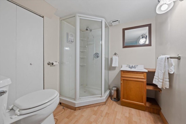 931 Sanctuary Ln, Naperville, IL 60540 - bathroom featuring toilet, a stall shower, visible vents, and wood finished floors