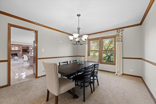931 Sanctuary Ln, Naperville, IL 60540 - dining room featuring crown molding, a notable chandelier, light colored carpet, and baseboards
