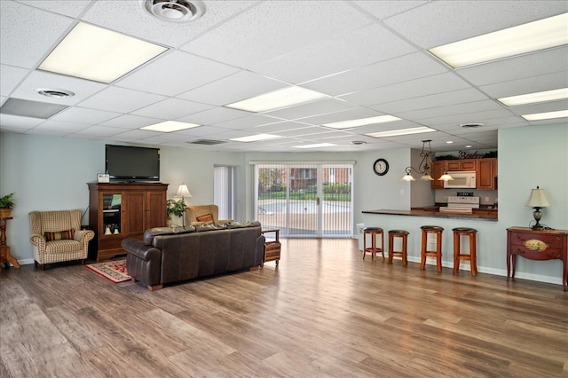 1053 W Ogden Ave Unit 350, Naperville, IL 60563 - living room with visible vents, wood finished floors, and a drop ceiling