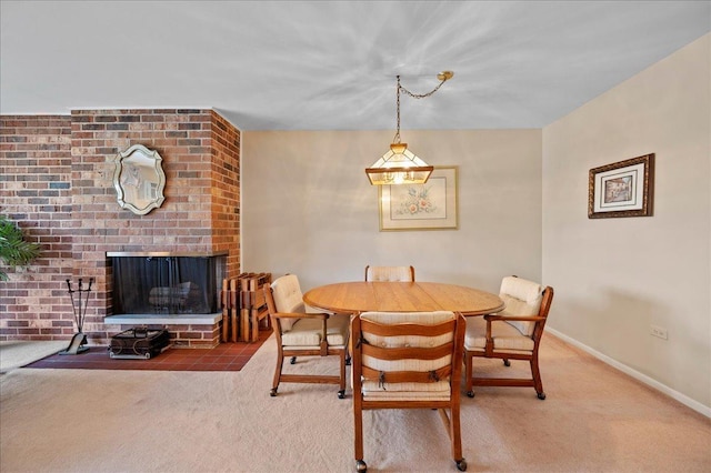 1053 W Ogden Ave Unit 350, Naperville, IL 60563 - dining area featuring baseboards, carpet floors, and a fireplace