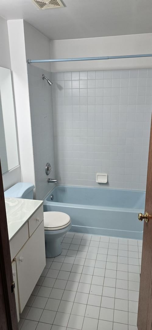 210 Braxton Ct, Grayslake, IL 60030 - bathroom with tile patterned floors, vanity, shower / tub combination, toilet, and visible vents
