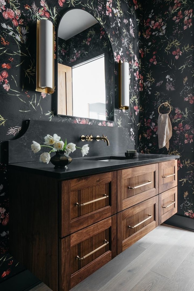 905 N Webster St, Naperville, IL 60563 - bathroom featuring vanity, wood finished floors, and wallpapered walls